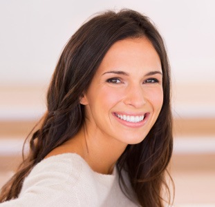  brunette woman smiling with white teeth