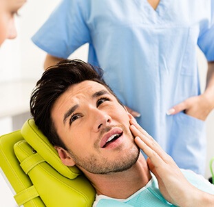 man in pain from a toothache