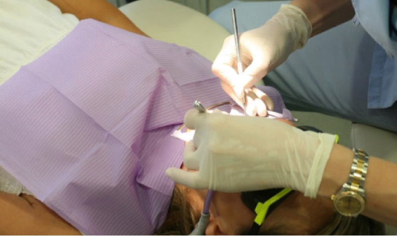 oral surgery to extract wisdom teeth from a teen patient