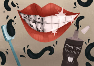 charcoal toothpaste on smiling teeth